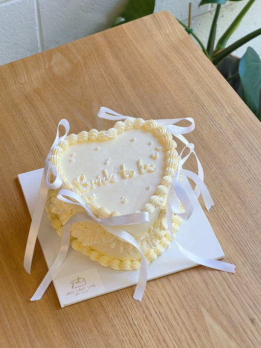 Vintage White Ribbon Heart Cake