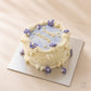 Lilac vintage birthday cake with purple flowers and cream piping in Adelaide