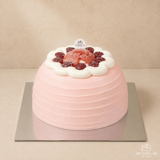 Blush guava cream and red grape cake with a pink textured finish in Adelaide