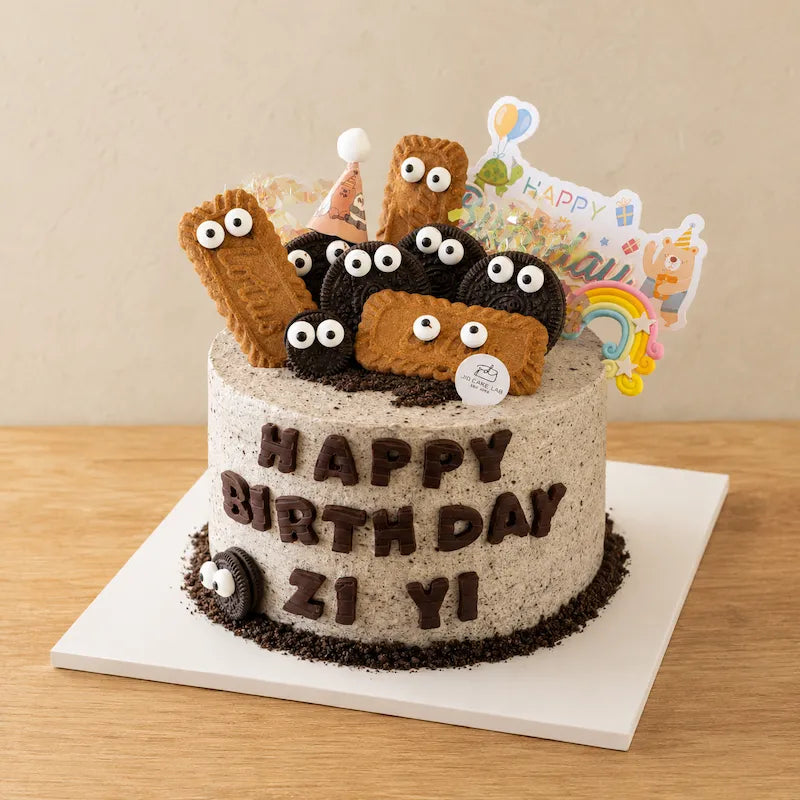 Three-quarter view of Chocolate Sea Salt Oreo Birthday Cake with Oreo cookies, biscuit toppers and edible eyes