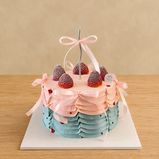 Pastel Ribbon and Ruffles Cake with pink bows, blue cream piping and strawberries in Adelaide