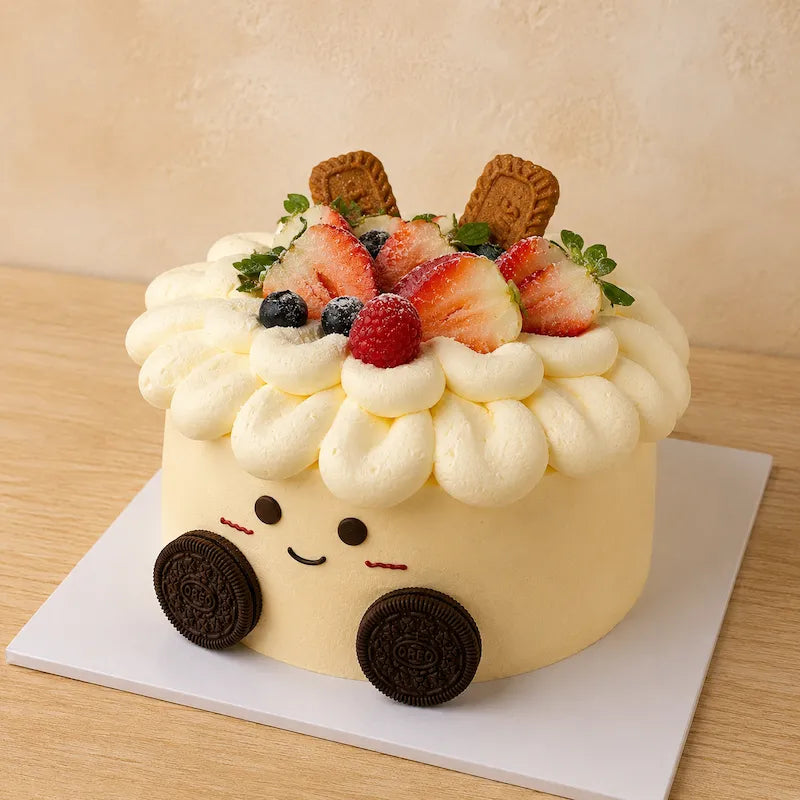 Three-quarter view of Jellycat Style Fruit Cake topped with strawberries, berries and biscuit decorations