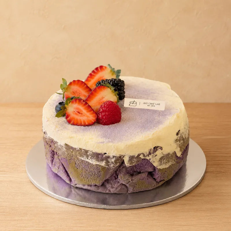Taro and ube Basque burnt cheesecake with fresh berries from J&D Cake Lab Adelaide