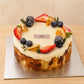 Three-quarter view of creamy Basque burnt cheesecake decorated with strawberries, berries and citrus