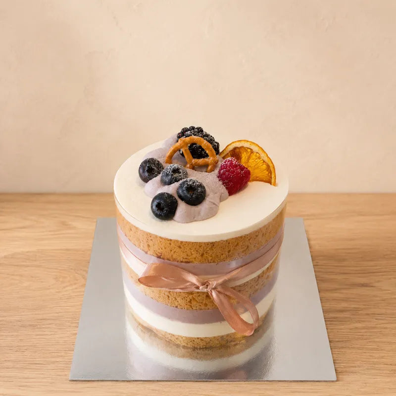 Taro Naked Cake with visible chiffon and taro cream layers, clear cake collar and fruit decoration in Adelaide