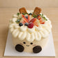 High-angle view of Jellycat Style Fruit Cake with fresh fruit, biscuits and layered cream piping