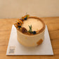 Three-quarter view of Classic Chestnut Cream Cake with chestnut cream piping and decorative toppings