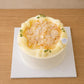 High-angle view of Trio Musang King Durian Cream Cake topped with almond flakes