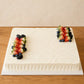 Front view of vanilla strawberry slab cream cake with strawberry, blueberry and blackberry decoration