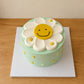 Daisy Smiley Face Cake in mint green with white daisy top from J&D Cake Lab Adelaide