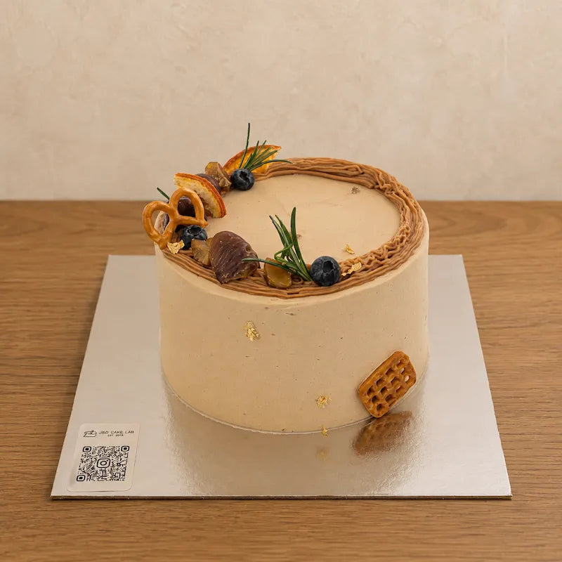 Top view of chestnut cream cake with chestnut piping, blueberries and decorative details