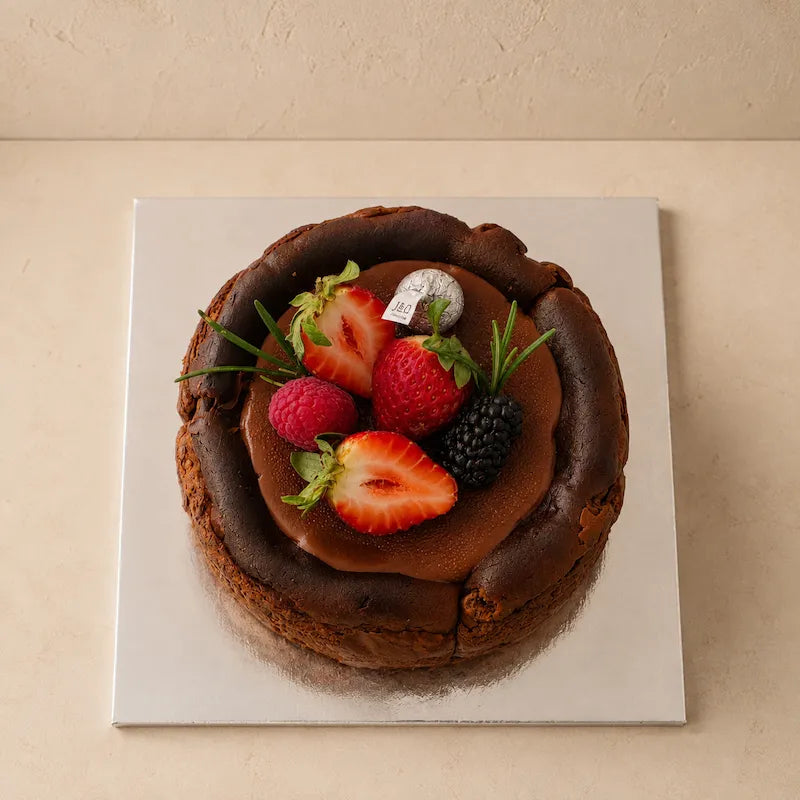 Top view of Chocolate Basque Burnt Cheesecake with mixed berry decoration