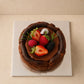 Top view of Chocolate Basque Burnt Cheesecake with mixed berry decoration