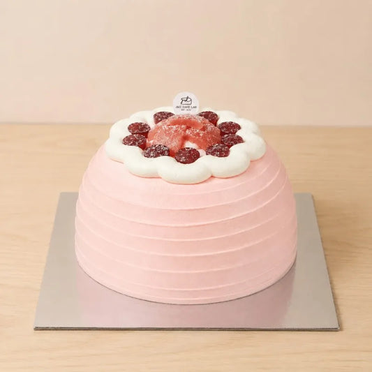Blush guava cream and red grape cake with a pink textured finish in Adelaide