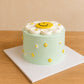 Birthday Daisy Smiley Face Cake with soft mint finish and cheerful daisy top design