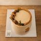 Close-up of chestnut cream piping and decorative toppings on a classic chestnut cake