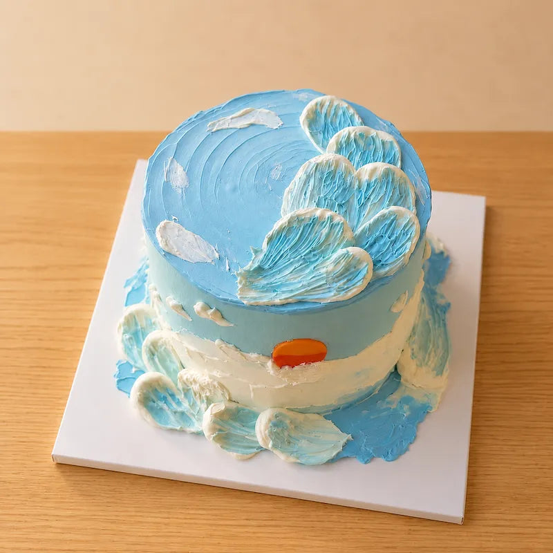 Ocean sunset fresh cream cake with blue and white buttercream waves in Adelaide