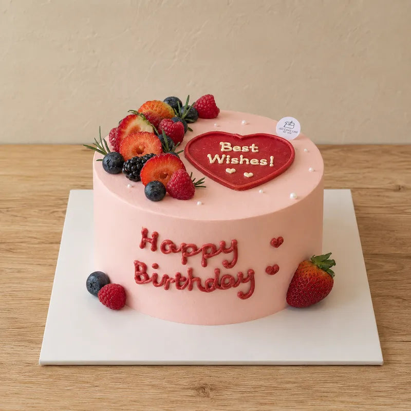Front view of pink heart message cake with seasonal fruit and personalised cream writing