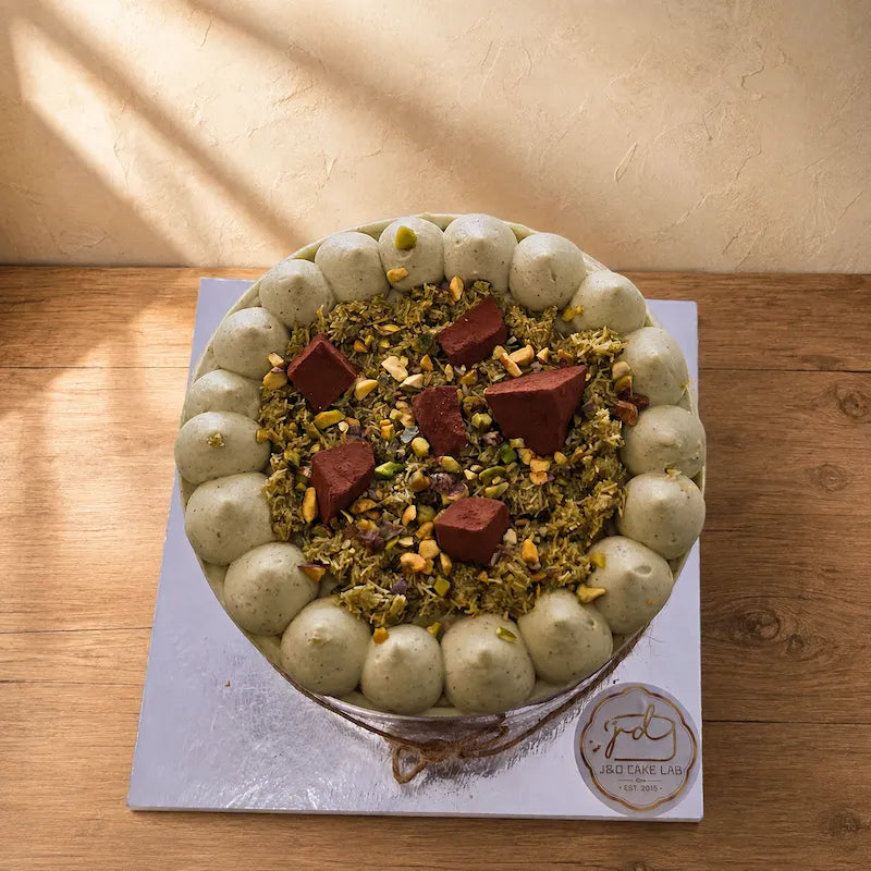 Top view of Dubai chocolate pistachio cake with kataifi, chopped pistachios and chocolate pieces