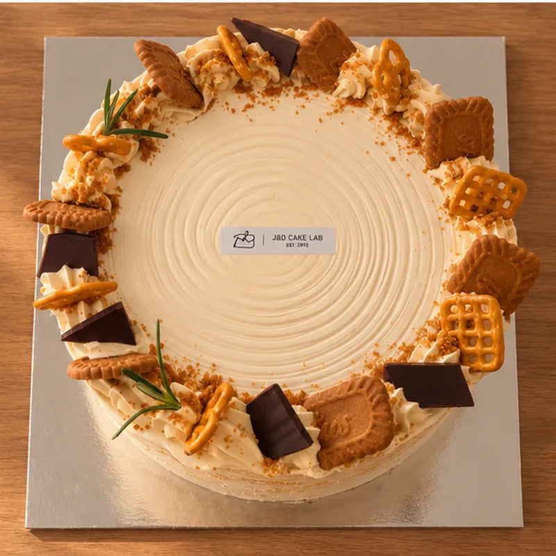 Top view of Earl Grey Biscoff crepe cake with assorted biscuit decorations
