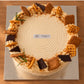 Top view of Earl Grey Biscoff crepe cake with assorted biscuit decorations